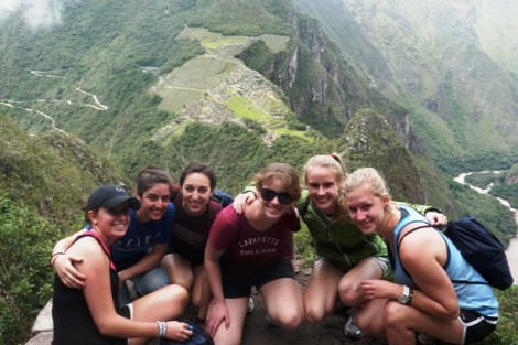 Students rest on a mountain overlooking Machu Picchu. The course focused on Peruvian society, culture, and history.