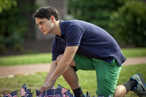 John Kling, vice president of the College Republicans, plants a flag on the Quad.