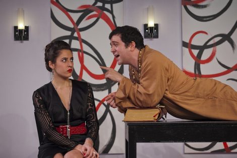 Two students act on stage in a scene from the Lafayette production of the play Tartuffe.