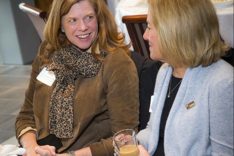 Virgina Logan '81, P'15 speaks with Barb Levy '77. Virgina received the Woodring Service Award.