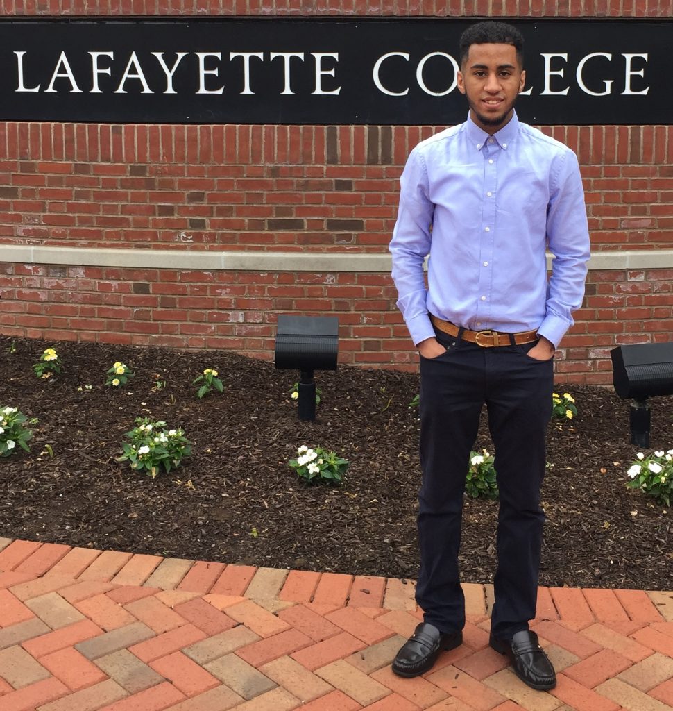 Tawfiq Alhamedi stands in front of a Lafayette College sign