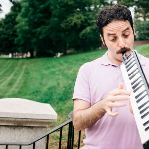 Matthew LeVine, who has an undergraduate degree in music, plays the melodica.
