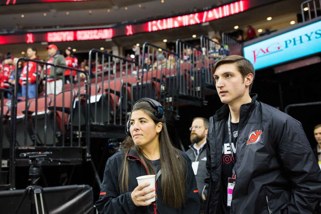 As part of their externship with the New Jersey Devils, Tymir Jones '18 and Matt Peters ’19 experienced behind-the-scenes activities at an ice-hockey game with host Alexa Ikeler ’13.
