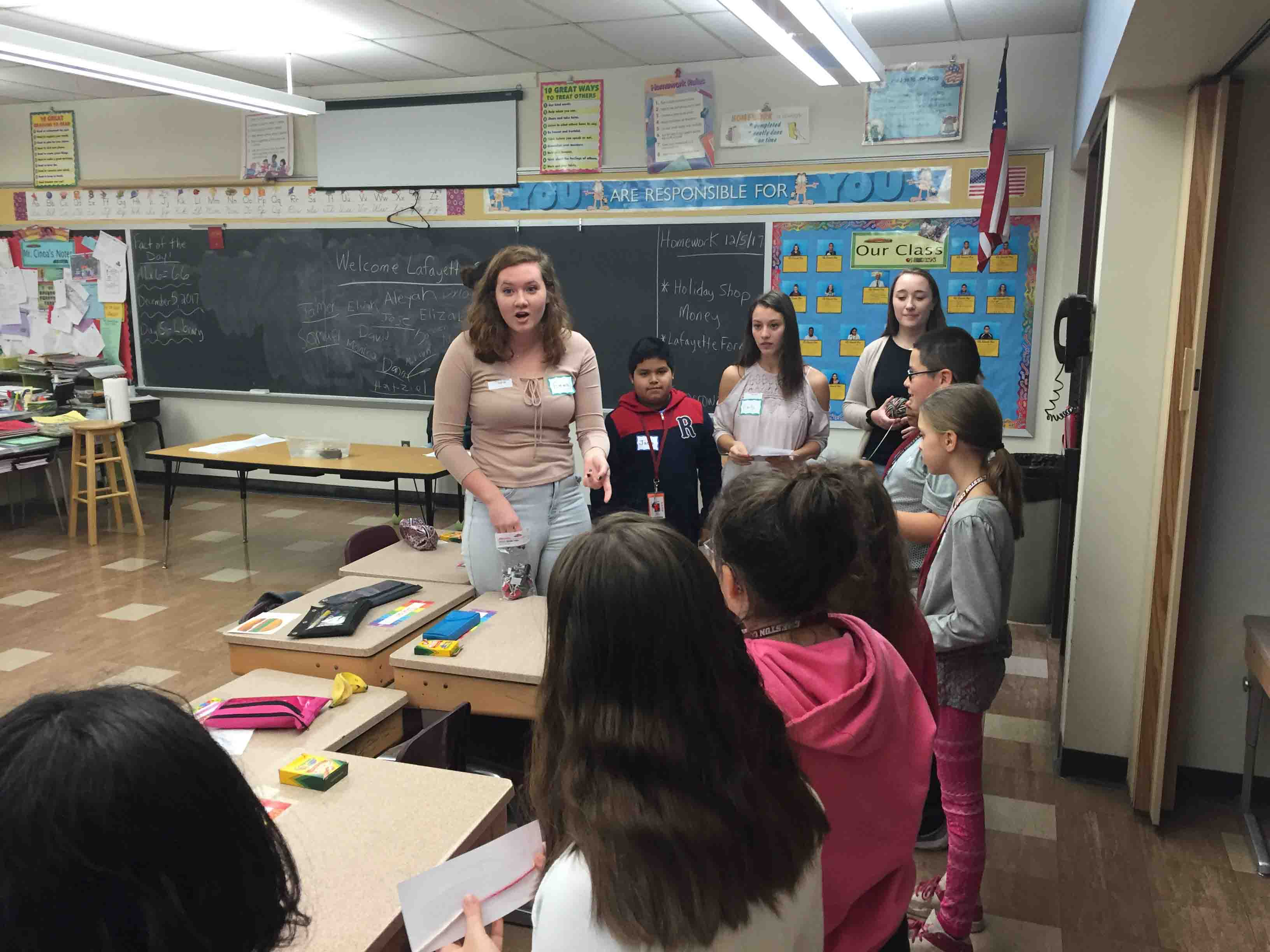 A Lafayette student teaches Cheston Elementary children about climate change in a classroom session.