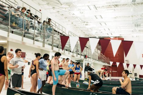 Students try to flood and sink other canoes in the Battleship game in Weinstein Natatorium.
