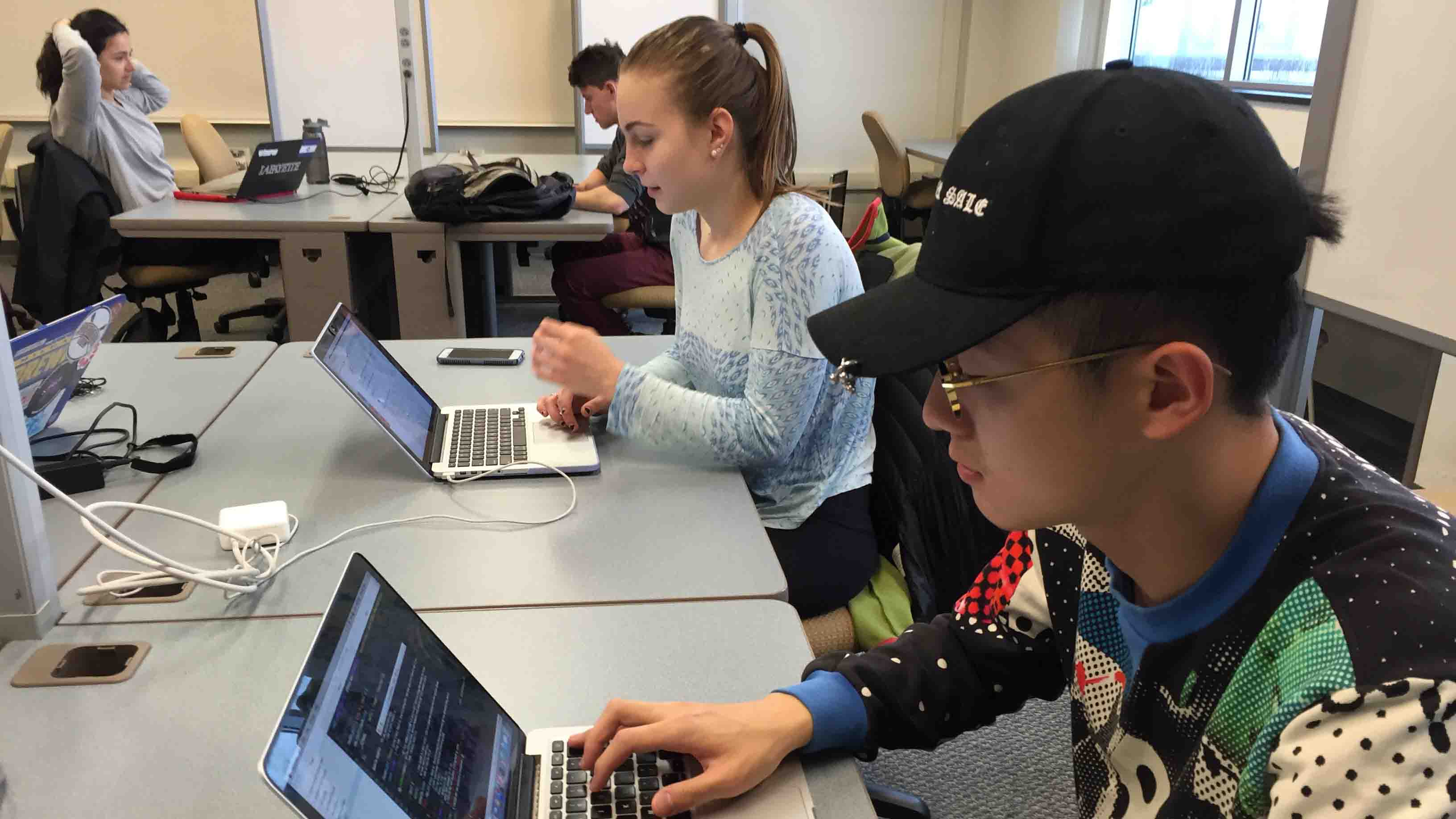 Students use laptop computers to work in the Computer Science Thinking Room.