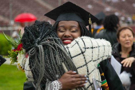 A hug between daughter and mother after Commencement
