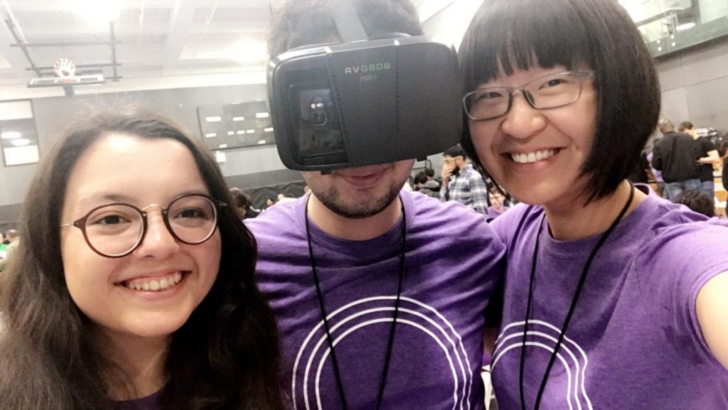  Wassim Gharbi '19 wears his Third Eye virtual reality device in a photo with fellow computer science majors Danhui Zhang ’18 and Rabia Demirelli ’21 at the HackNYU hackathon.