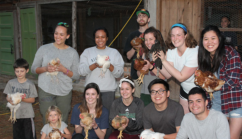Students with chickens in Honduras