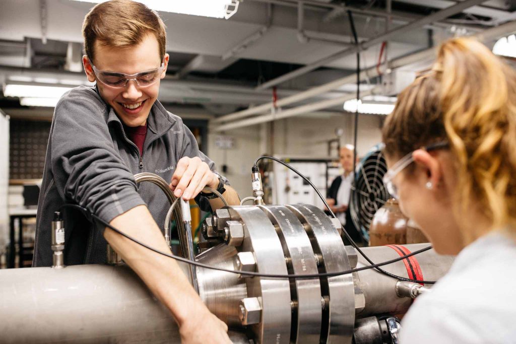 Andrew Schmid ’20 and Alyssa Devin '19 work on the expansion tube in a mechanical engineering lab.