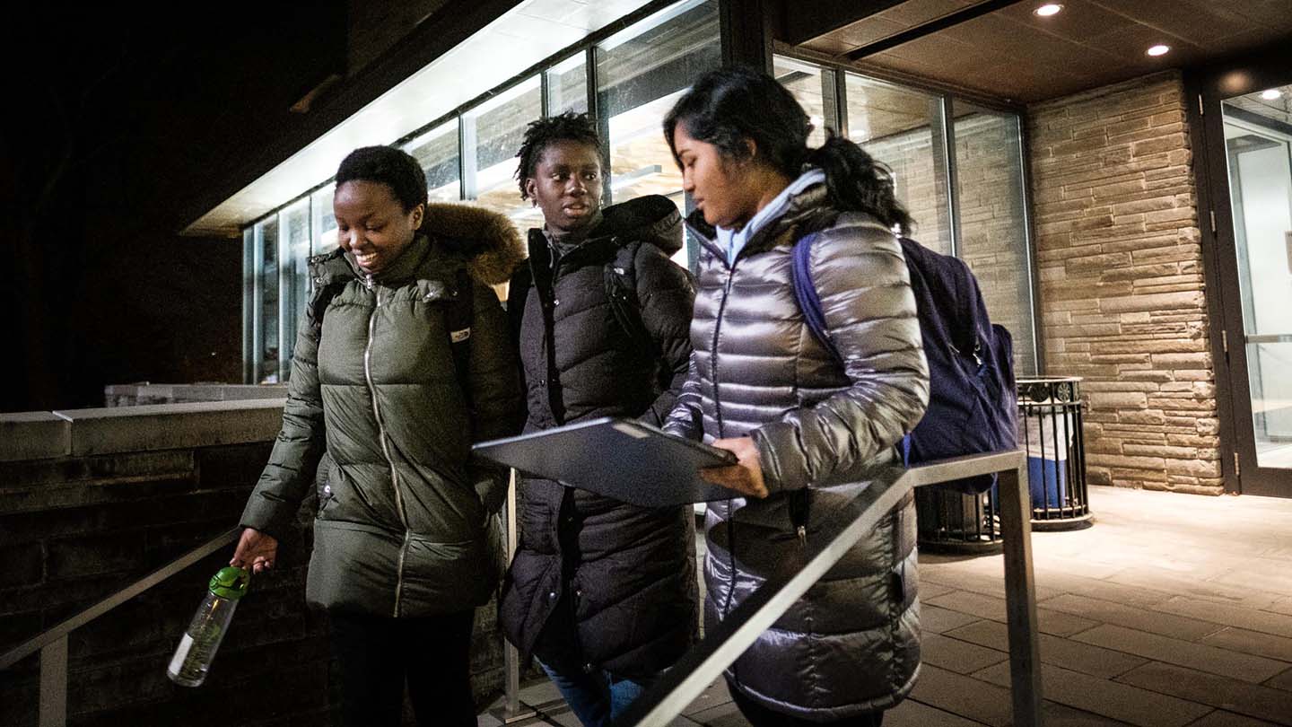 Students leave Skillman Library after a late night of studying.