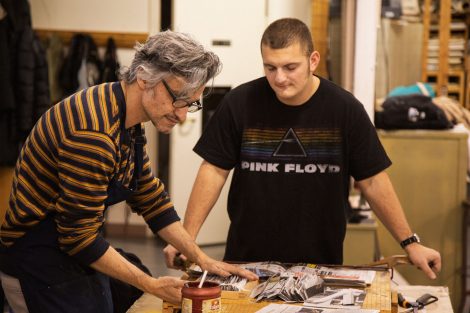 Pedro Barbeito, director of Lafayette College's Experimental Printmaking Institute, works on art as a student watches.