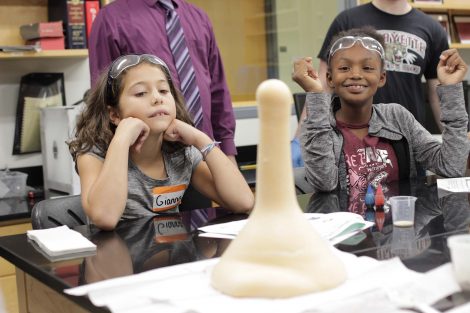 Students smile at the amount of elephant toothpaste.