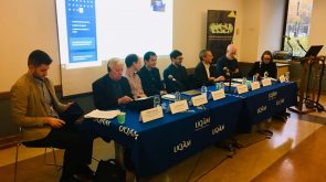 John Kincaid sits at a presentation table with other scholars at the international conference, Federalism, Democracy and National Diversity in the 21st Century: Challenges and Opportunities, hosted by University of Quebec.