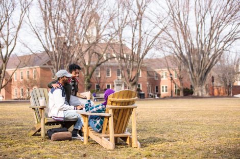 students sitting in chairs on the quad