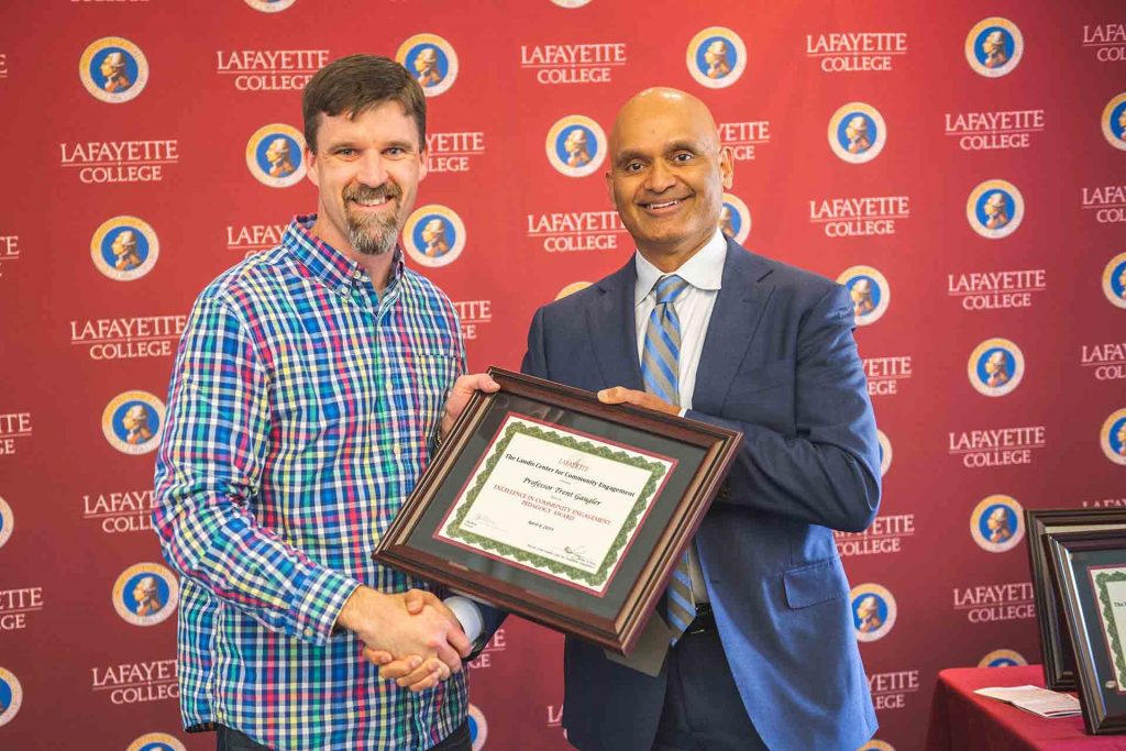 Assistant Prof. Trent Gaugler with provost Abu Rizvi