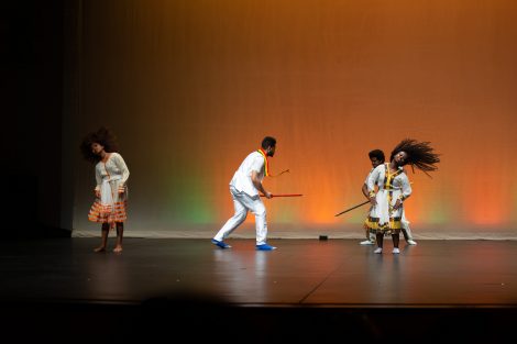 students dance and perform on stage for ISA Extravaganza