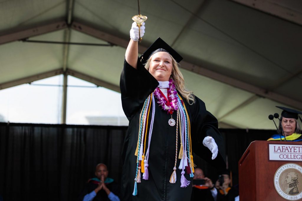 Reeve Lanigan '19 holds the sword of the Marquis de Lafayette at Commencement.