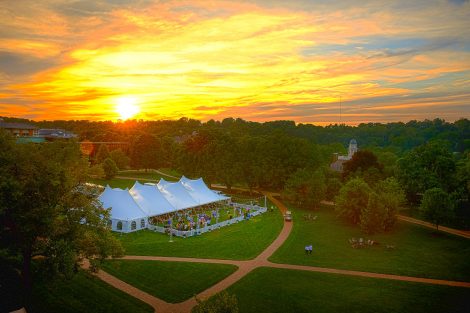 The sun sets over the reunion celebration on the Quad.