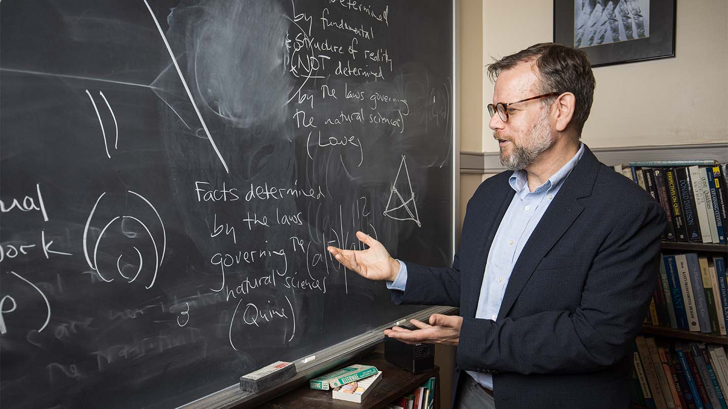 Prof. Joe Shieber, who was tapped to teach a video and audio course for The Great Courses, teaches at the front of a classroom.