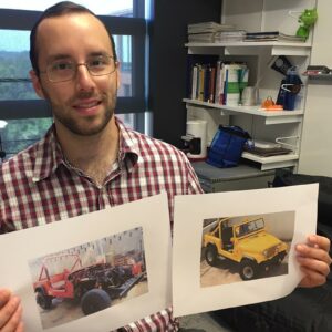 Christian Lopez Bencosme holds a before-and-after picture of the 1985 CJ-7 Jeep his father and he restored when he was a youth.