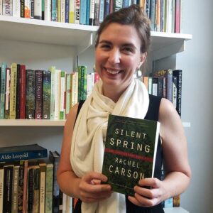 Sarah Dimick holds a copy of the book Silent Spring.