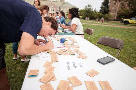 Students meeting with clubs and organizations on the quad during the activities fair