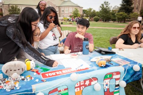 Students meeting with clubs and organizations on the quad during the activities fair
