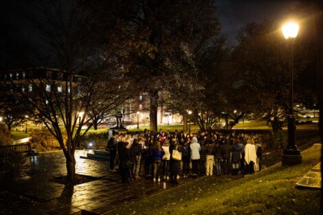students light candles as part of the take back the night vigil