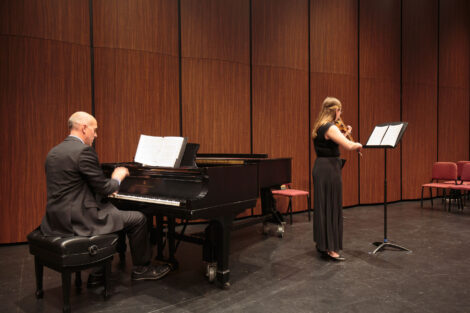 Students perform at the honors recital for students taking lessons