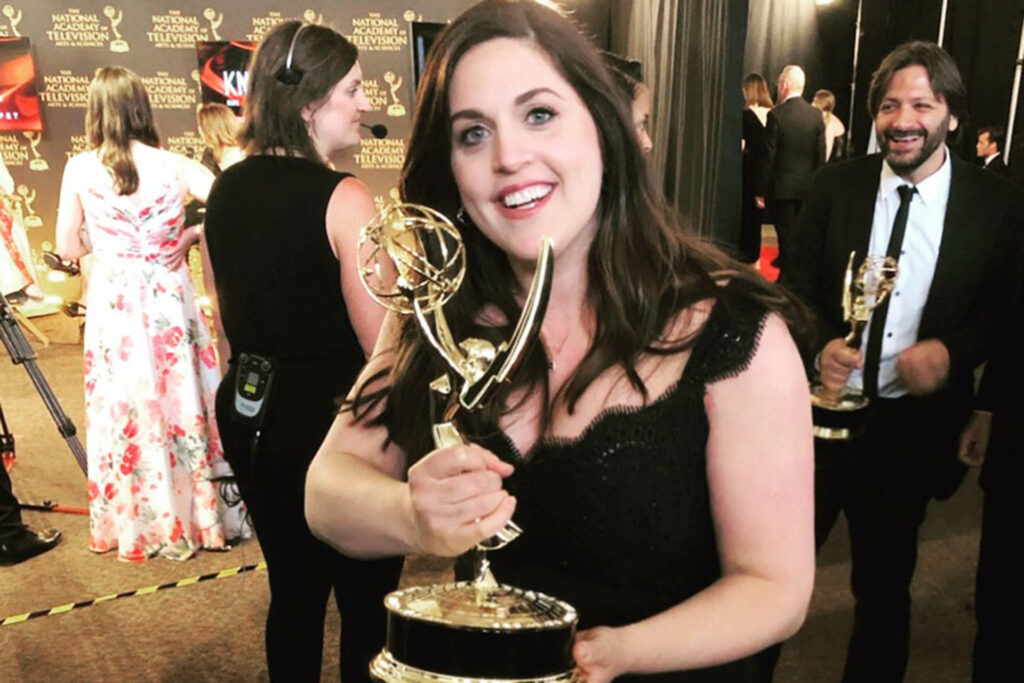 Jen Gsell '04 holds her Emmy