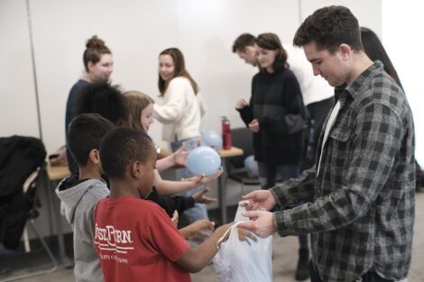 Lafayette students hand out balloons that represent water