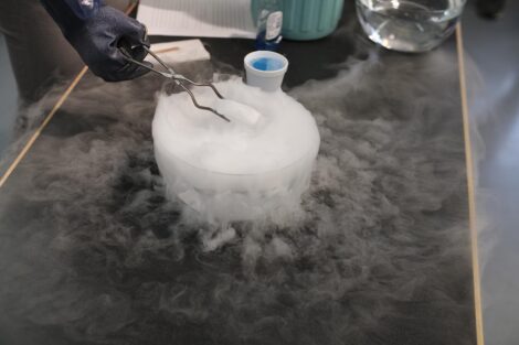 Dry ice is placed in a bowl of water