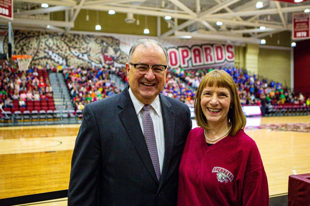 Mayor Panto and President Byerly smile at the game