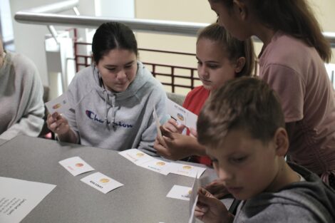 Students make selections from emoji cards