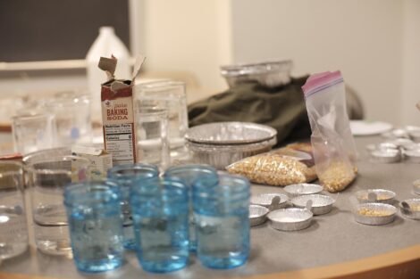 Materials are ready for one experiment, including popcorn and baking soda