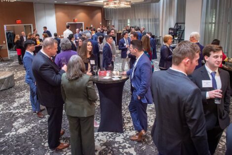 Wide shot of all gathered as they mingle at Networking Night