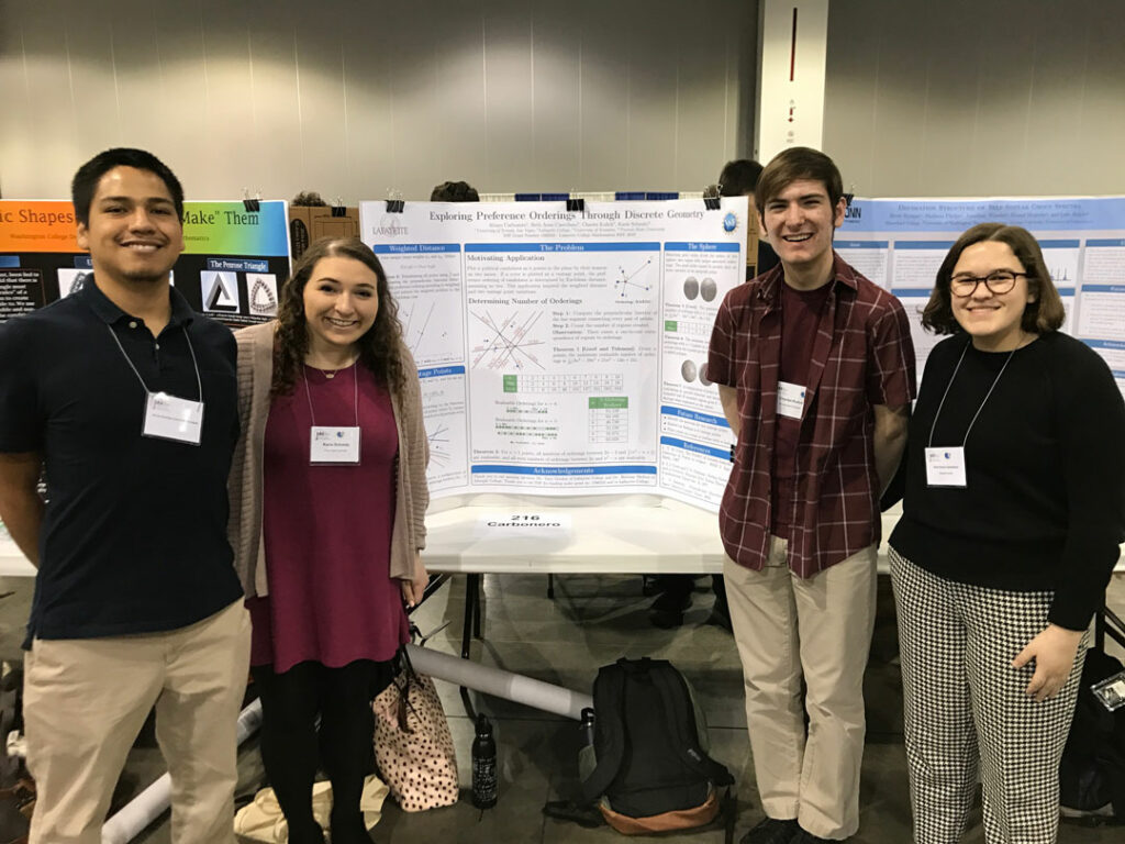 Students stand with their poster at the January Math Meeting in Denver