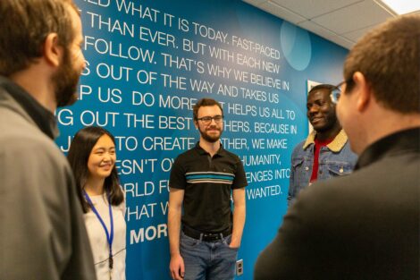 Externs gather at wall that names company's values