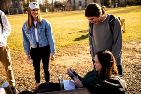 Students enjoying an unseasonably warm day on the Quad in Winter,.