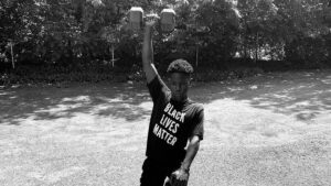 Martin Ssessanga ’21 exercises in a BLM T-shirt