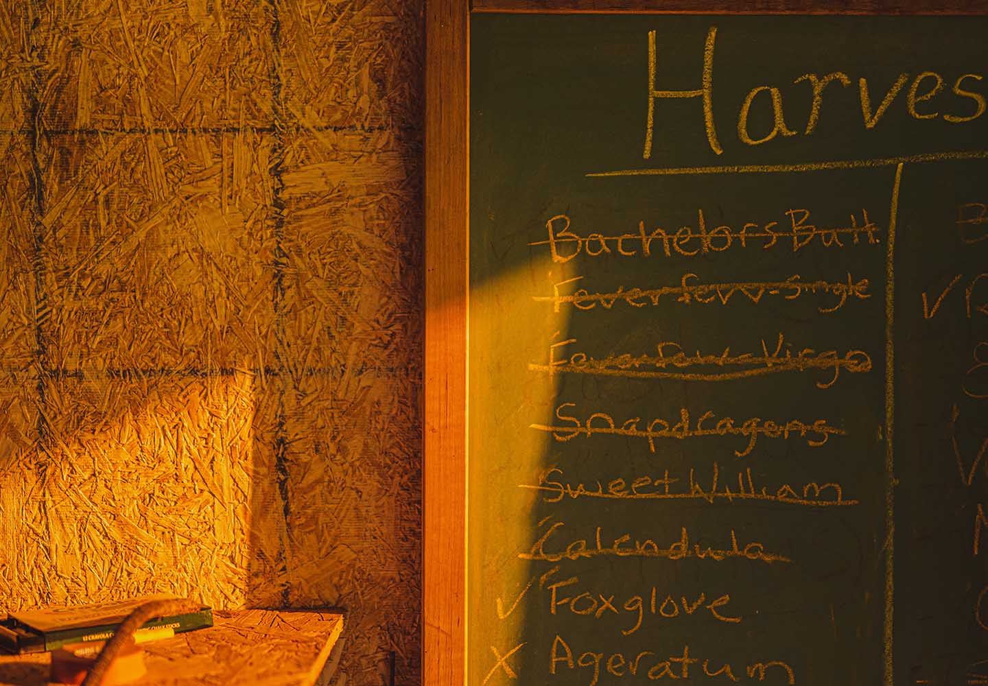a chalkboard with Jenn McAtee's harvest list
