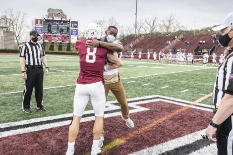 Lafayette College football player hugs Lehigh football player