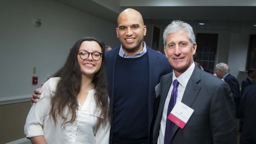 Image from scholarship dinner shows Rabia on the left, Yusuf Dahl in the center, and alumnus JB Reilly on the left