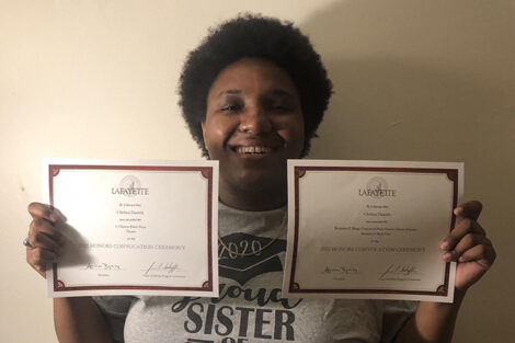 Chelsea Daniels holds two certificates