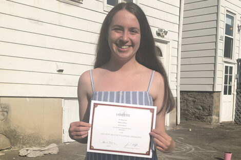 Molly LaPoint holds certificate