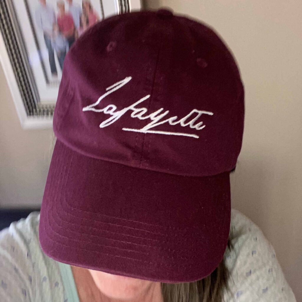 Alumna wearing a Lafayette hat