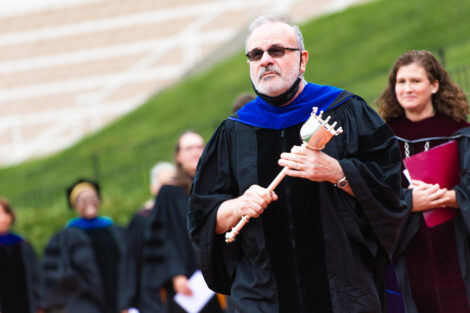 Prof. Ilan Pelig walks in processional with President Nicole Hurd behind him