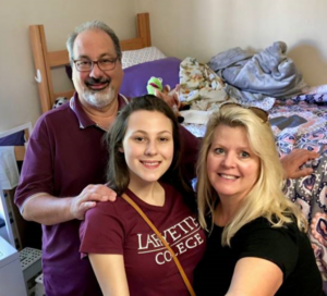 Serena Fenaroli is pictured with her parents in her dorm room at Move In in 2020