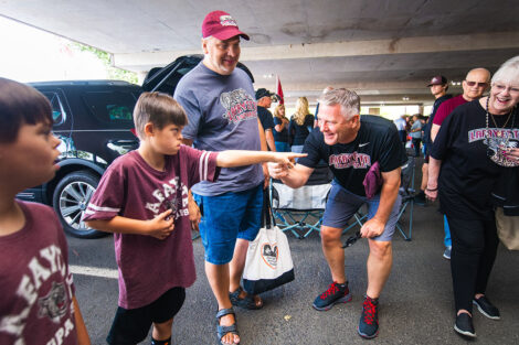 Families mingle on Markle Parking Deck while tailgating.